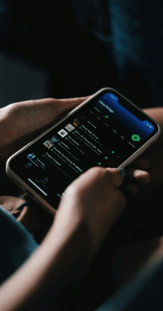 A smartphone screen showing a fall-inspired music playlist designed to match autumn aesthetics and reset intentions.